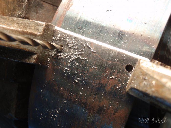 Spring repair rivet hole drilling